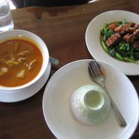 Massuman curry and crispy pork over kale at Si Trang in Chiang Rai