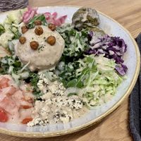 Mediterranean bowl with tempeh and greens added on  at Kind Cafe in Vancouver