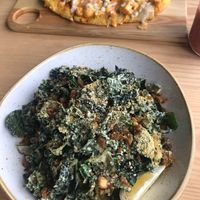 Kale Caesar salad and buffalo cauliflower flat bread :) at Kind Cafe in Vancouver