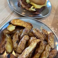 Two handed sandwich and home fries   at Project Coffee - Burns Court in Sarasota