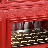 Cinnamon rolls and hostessy looking dudes. I resisted the temptation.    at SweetArt in St Louis