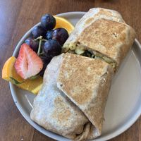 Soul Food Burrito- savory greens + cashew mackin’ cheese + your choice of crispy chikn or cauliflower bites or oyster mushroom + choice of sauce  at SweetArt in St Louis