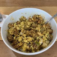 Papa’s Breakfast Bowl- tofu scramble + sausage + creole potatoes + house-made biscuit + side of jam (pictured is mixed together)  at SweetArt in St Louis
