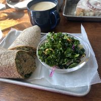 Jackfruit tuna wrap, caramel latte, kale salad, cinnamon rolll  at SweetArt in St Louis