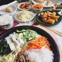 Vege hot stone bowl bibimbap no egg and banchan (side dishes) and mandu (fried veggie dumplings) at Koja Cuisine in Easton