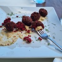 Tomato balls on hummus at Let's Vegan in Crete