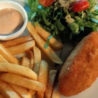 Vegan chicken fillet filled with a lanvender sauce, salad and fries at Let's Vegan in Crete