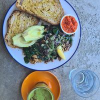 Tofu & Mushroom Scramble (+avo and relish) and macha latte. Yum! at Harvest Cafe in Daylesford