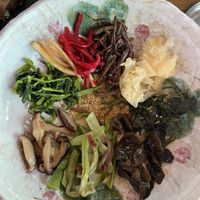 Veggies into my own bowl, sesame oil in the middle. No gochujang needed, already so flavorful  at Jeombongsan Sanchae in Sokcho