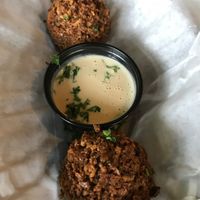 Two felafel with tarator sauce. Crispy outside, soft and tasty on the inside.  at Mooney's Mediterranean Cafe in Winston-salem