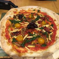Vegan pizza with tofu strips, mushroom, rocket pesto, tomatoes, and sun-dried tomatoes  at Hedonist in Zadar