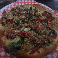 Vegan pizza with vegan pesto, vegan parmesan with roasted veggies  at 555 Brewing Co in Picton