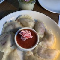 Strawberry dumplings and vegan mascarpone/ pistachio dessert   at Pierogarnia Mandu Centrum in Gdansk