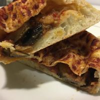 Vegan calzone with cherry tomatoes and eggplant (take away) at Trigo in Barcelona