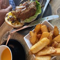 Vegan burger and side of chunky chips at PEACH in Newport