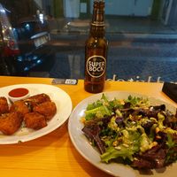 Chicken nuggets and pesto salad at Kind Kitchen in Porto