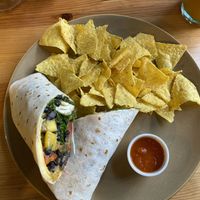 Burrito with mango, beans and tortilla chips at Kind Kitchen in Porto