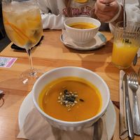 Vegetable soup of the day: pumpkin. Drink is the porto tónico. at Kind Kitchen in Porto