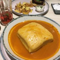 Francesinha (seitan burger in the background).   at Kind Kitchen in Porto