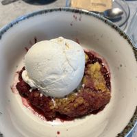Mixed berry crumble with vanillas ice cream   at Kind Kitchen in Porto