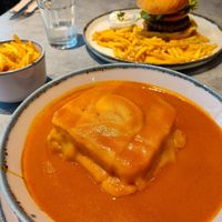 Francesinha with fries at Kind Kitchen in Porto
