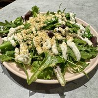 Spring greens with a whipped feta dressing. 🔥  at Kind Kitchen in Porto