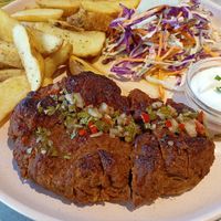 Seitan caseiro com molho chimichurri at Kind Kitchen in Porto