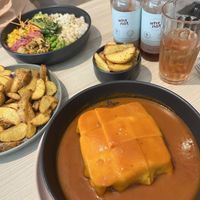 Francesinha, Poke Bowl and chips (all vegan)  at Kind Kitchen in Porto