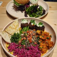 Middle East bowl and black bean mushroom burger on sourdough bun. at Kind Kitchen in Porto