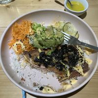 Salmon bowl partially eaten   at Kind Kitchen in Porto