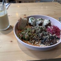Middle eastern bowl and pineapple and turmeric smoothie    at Kind Kitchen in Porto