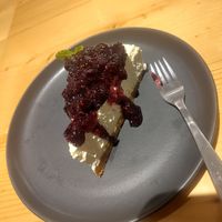This is the berry cheesecake. It is vegan and gluten free. There is a sprig of mint at the back. Make it the last mouthful. at Kind Kitchen in Porto