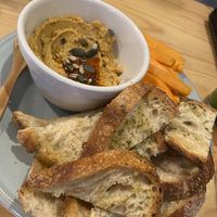Hummus, sourdough and carrot sticks x at Kind Kitchen in Porto