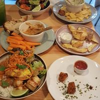 From bottom to top: Thai budda bowl and nuggets, hummus with dips and chips, guacamole with nachos and Mexican budda bowl at Kind Kitchen in Porto