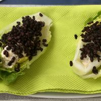 Salad shuttle with cream filling and crispy black rice topping at MythenForum in Schwyz