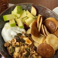 Granola w/ vegan mini pancakes   at The Garden Bar in Thessaloniki