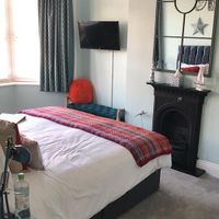 Large room has en-suite shower room at Weymouth Vegan B&B in Weymouth