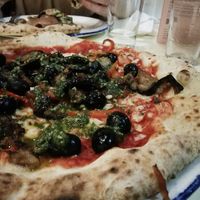 Roasted aubergine and peppers, black olives, vegan cheese, vegan pesto at PLY in Manchester