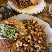 The Cowboy (chickpea scramble, shiitake cake) + Jackfruit “chicken” & waffles  at Cultivate Cafe in Jackson