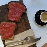Cortado with oat milk and pan con tomate with hearty homemade bread (€2,50)! at La Casa Encendida in Madrid