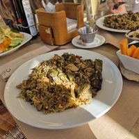Vegan paella, salad, and hummus at Suc de Lluna BioCafe in Valencia