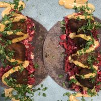 Buffalo Wing Tacos! Made with twice baked cauliflower, smokey beetroot slaw, chipotle mayo and fresh cilantro! at The Healthy Hub Cafe in Cairns