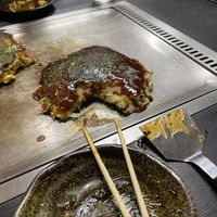 Vegan Okonomiyaki on the hot plate   at Okonomiyaki Chitose in Osaka