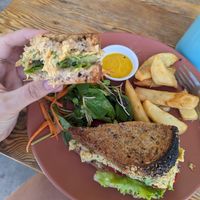 Smashed chickpea mayo toastie with side salad (already half eaten... sorry) and rosemary potato wedges at Blended in Cape Town