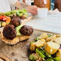 Toast with avocado and eggplant meatballs (vegan)  at Painapol in Holbox