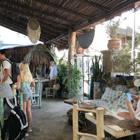 Seating area and street entrance at Painapol in Holbox