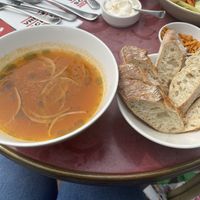 Clear minestrone soup with kapucijners (Dutch field peas), pomodori tomato and onion. Served with bread. at VRIENDSCHAP in Middelburg