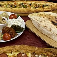 Veggie pide and a plate of mezze (vegetarian) at Harab'be Cafe in Istanbul