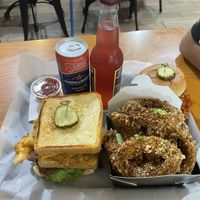 Fried green tomato sandwich, onion rings, buffalo chik’n sandwich (in the back)  at Bubbie's - Plant Burgers at Plant Food Lab in Washington