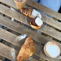plain croissant, almond croissant and a free cinnamon roll!   at Canela in Calgary